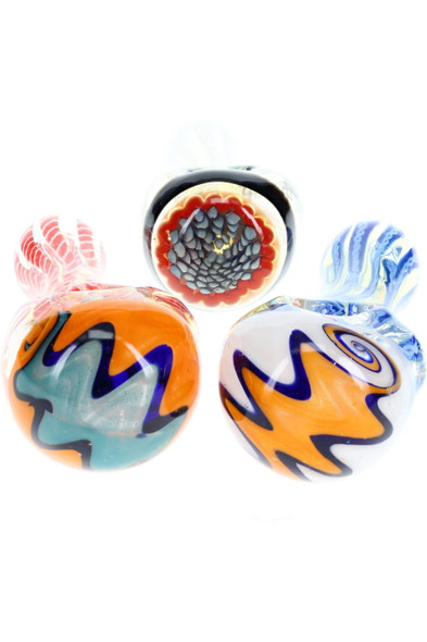 Close view of three reverse and floral bowl designs on 5" striped spoons, assorted neon accents; detailed product shot for retail smoke gear. Close view of three reverse and floral bowl designs on 5" striped spoons, assorted neon accents; detailed product shot for retail smoke gear.