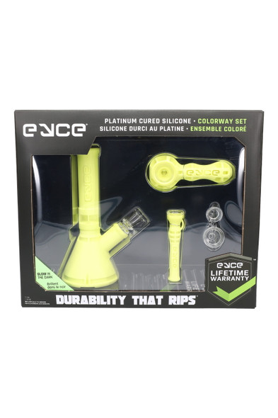 Glow Dark Eyce Colorway box with neon silicone Mini Beaker, Spoon, Shorty and two extra bowls; retail smoke-shop bundle, straight-on angle.