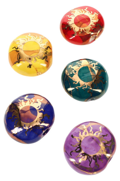 Wholesale 2-inch round ceramic smoke stones, assorted red yellow teal purple, 22 k gold sun design top-down group view.