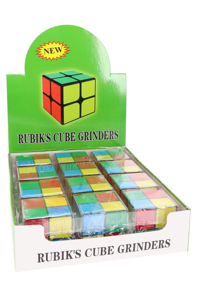 Shelf-ready display of 12 Rubik’s cube plastic grinders in assorted colors, 1.5-inch size for wholesale retail smoke gear.