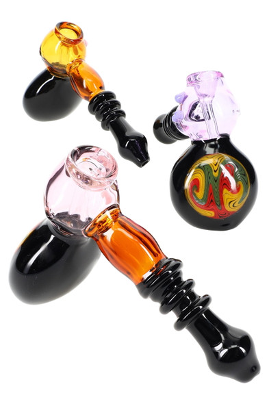 7-inch reverse-glass hammer bubblers with rasta medallions, amber and lavender bodies, black base and mouthpiece, angled group view for wholesale buyers 7-inch reverse-glass hammer bubblers with rasta medallions, amber and lavender bodies, black base and mouthpiece, angled group view for wholesale buyers