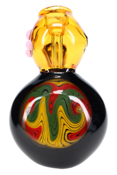Close-up of 7-inch reverse rasta medallion on black-base hammer bubbler with amber chamber, detailed front view for head-shop retail Close-up of 7-inch reverse rasta medallion on black-base hammer bubbler with amber chamber, detailed front view for head-shop retail