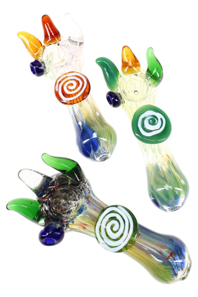 Three 5" silver-fumed color-changing glass spoons with spike accents and swirl marbles; assorted colors, wholesale head-shop angle, bright white backdrop. Three 5" silver-fumed color-changing glass spoons with spike accents and swirl marbles; assorted colors, wholesale head-shop angle, bright white backdrop.
