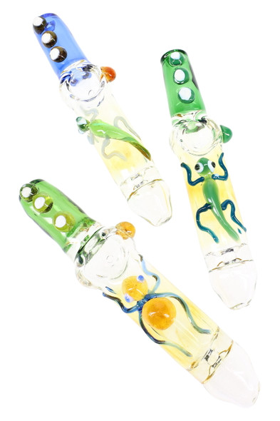 Three 7" color-changing glass steamrollers with sculpted critter accents and green/blue mouthpieces; wholesale head-shop product shot, angled top view. Three 7" color-changing glass steamrollers with sculpted critter accents and green/blue mouthpieces; wholesale head-shop product shot, angled top view.