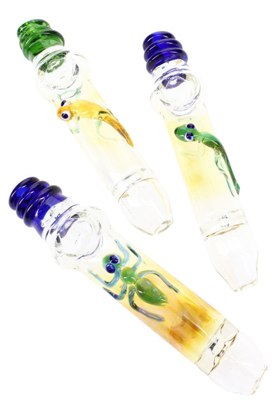 Three 6.5" color-changing glass steamrollers with sculpted critter accents and blue/green mouthpieces; wholesale smoke shop listing, angled top view. Three 6.5" color-changing glass steamrollers with sculpted critter accents and blue/green mouthpieces; wholesale smoke shop listing, angled top view.