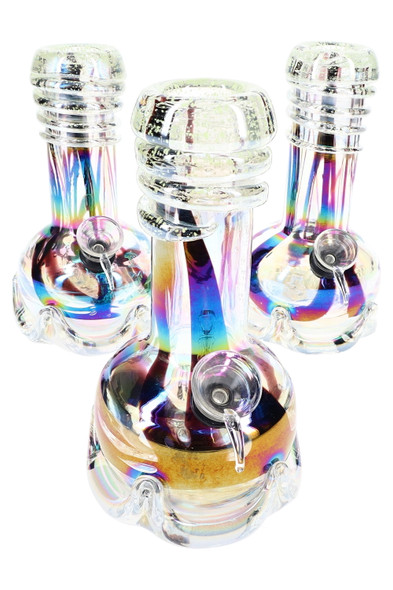 Bulk 7-in soft glass beaker bong with rainbow metallic finish and glow swirl top, group front angle on white background.