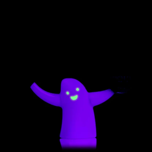 Glow effect view of ghost bubbler with neon face under black background; retail smoke-shop novelty, limited Halloween edition.