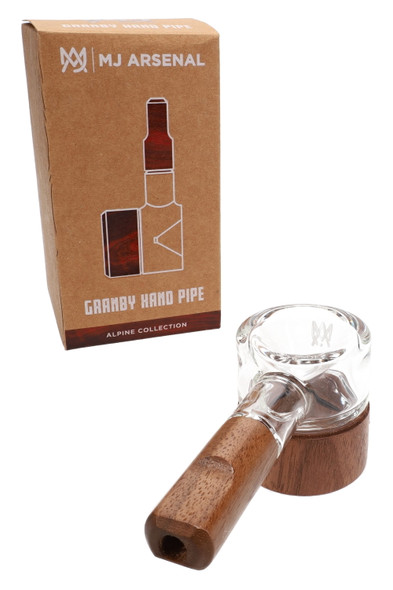 MJ Arsenal Granby Hand Pipe beside Alpine Collection retail box, clear glass with walnut accents; compact wholesale pipe shown angled on white.