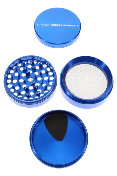 Blue 2.5" Cali Crusher O.G. aluminum 4-part grinder, components separated with mesh screen and catch tray, overhead view for wholesale catalogs. Blue 2.5" Cali Crusher O.G. aluminum 4-part grinder, components separated with mesh screen and catch tray, overhead view for wholesale catalogs.