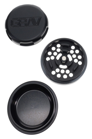 Black GRAV 2.75" 3-part aluminum grinder disassembled—magnetic lid, grind plate, and catch chamber—top-down layout for smoke-shop wholesale pages. Black GRAV 2.75" 3-part aluminum grinder disassembled—magnetic lid, grind plate, and catch chamber—top-down layout for smoke-shop wholesale pages.