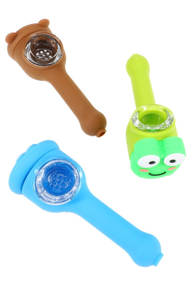 Assorted 4" silicone character hand pipes with removable glass screen bowls in blue, green and brown, laid out for smoke shop wholesale buyers.