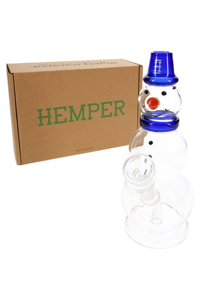 Hemper 8" Snowman bong with blue hat posed beside brown Hemper shipping box, holiday-themed glass water pipe display shot for B2B head-shop catalogs.