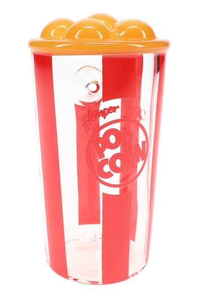 Front view of 4" popcorn bucket glass hand pipe with red stripes and yellow “kernels,” resale-ready
