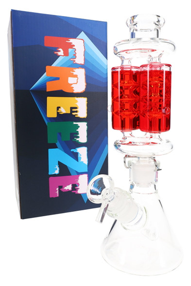 Smoke shop display shot: red fluid-filled beaker water pipe beside FREEZE retail box, angled view