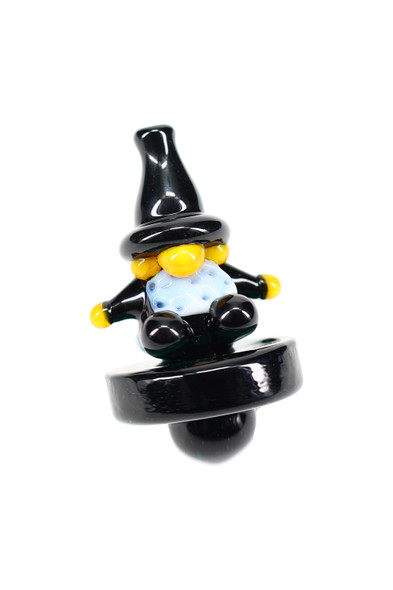 Black glass wizard carb cap with yellow hands and blue robe, front angle—wholesale dab accessory for shops