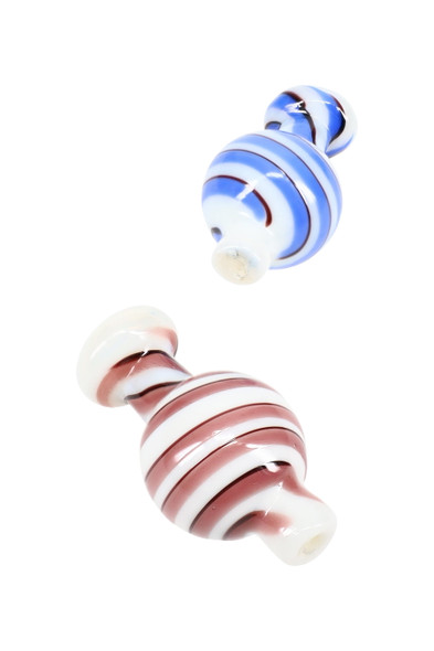 Two white glass striped carb caps in blue and burgundy swirl, top view—wholesale dab accessory assortment