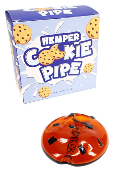Hemper Cookie Pipe retail box with amber cookie-shaped glass pipe, front angle—wholesale hand pipe