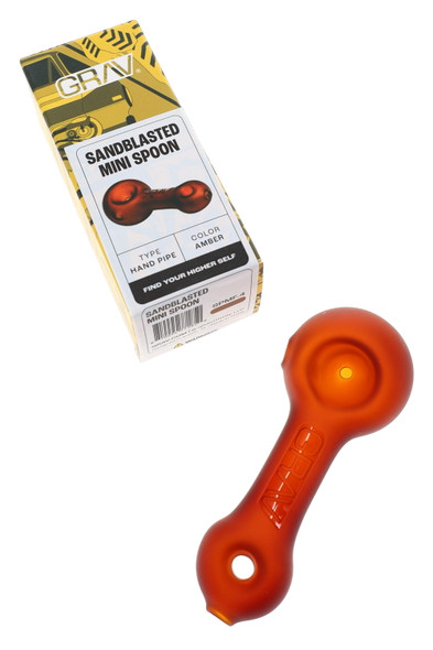 Amber sandblasted GRAV mini spoon with retail box for head-shop supplies, compact matte glass hand pipe in packaging view