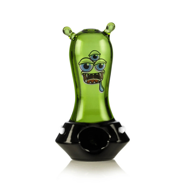 Green space monster glass hand pipe front view with black saucer base and multi-eye face decal
