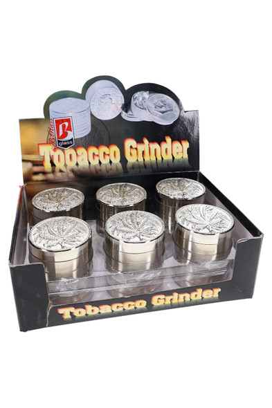 2" leaf design metal grinder shown closed with decorative top artwork for retail displays
