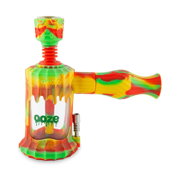 Rasta-inspired Ooze Clobb hybrid water pipe with red, yellow, and green silicone pattern and clear glass chamber