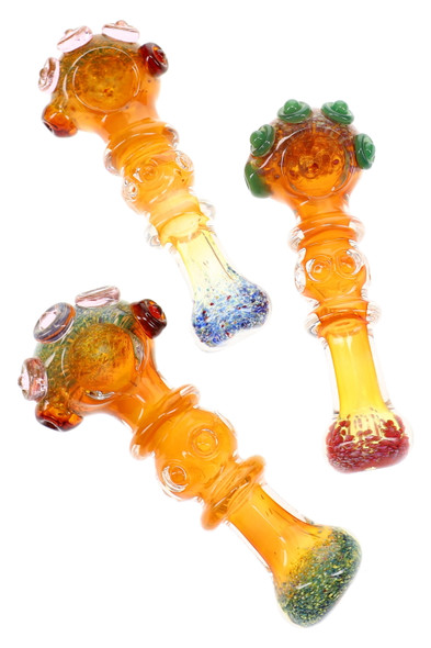 Assorted 5" gold fumed frit glass spoon pipes with indented ring details and raised marble accents displayed together