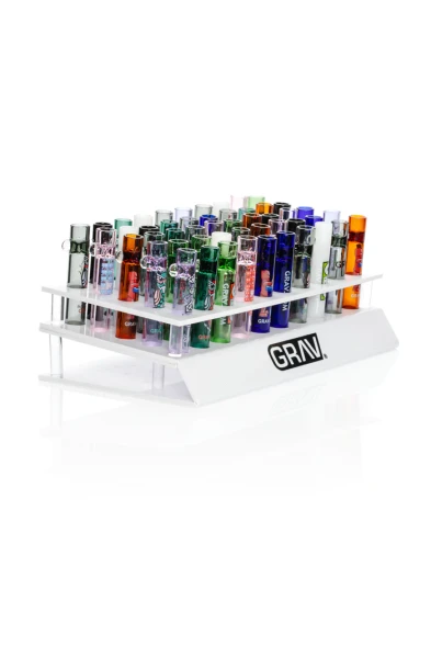 Angled white acrylic GRAV counter display filled with assorted colorful and graphic 16 mm glass tasters