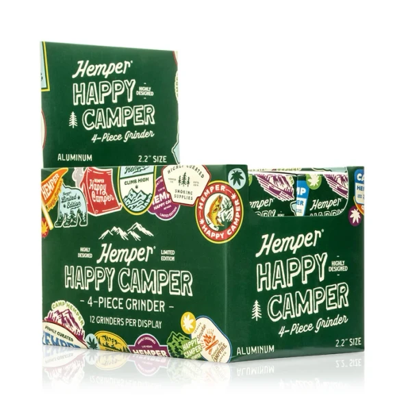 Twelve Hemper Happy Camper grinders arranged in a branded counter display for retail merchandising