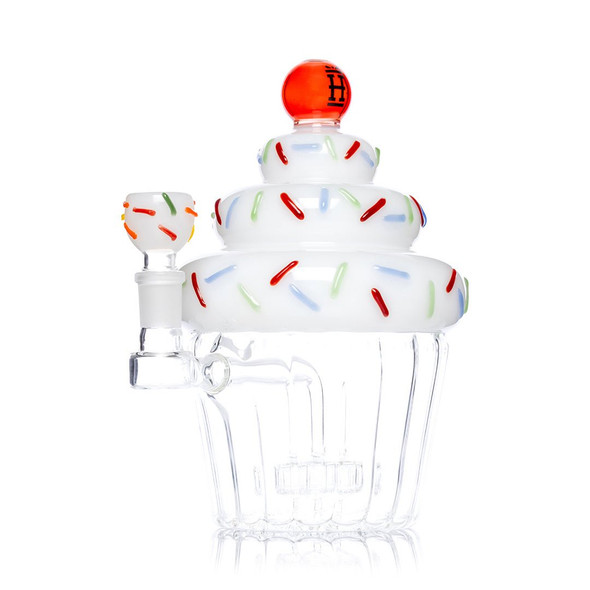 Angled Hemper Cupcake XL with white frosting, colorful sprinkles, red cherry top and matching bowl.