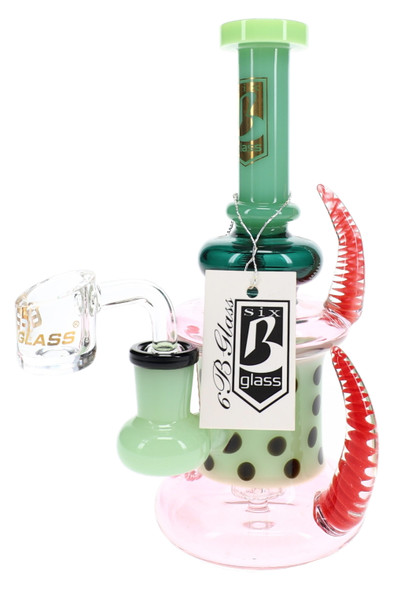Opposite view of the spiked dab rig with green accents, black dots, clear banger, and hanging 6B Glass tag.