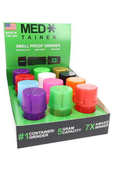Branded MedTainer counter display box holding twelve colorful 20 dram smell proof grinder jars, marketed as 5 gram capacity for retail head-shop buyers.