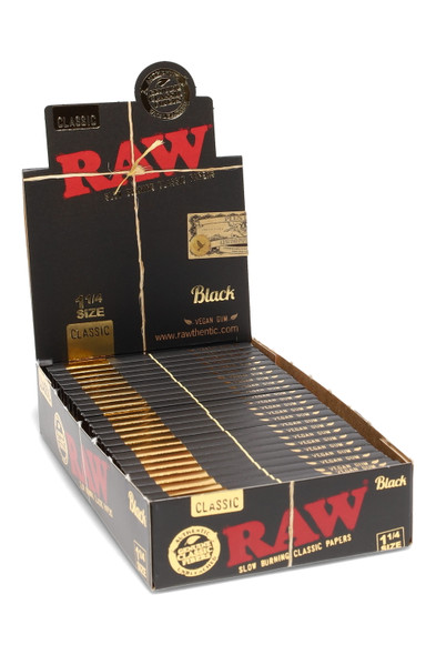 Wholesale RAW Black 1¼ rolling papers display—24 retail packs, black kraft POP box with flip-top header and red RAW logo, front angled view.