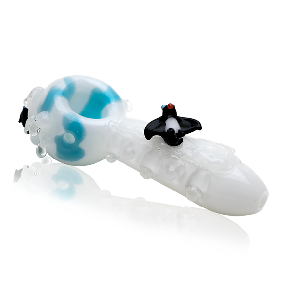Side profile of 4.5" white and aqua penguin-themed glass hand pipe on white background—retail smoke-shop wholesale image highlighting glossy finish and details.