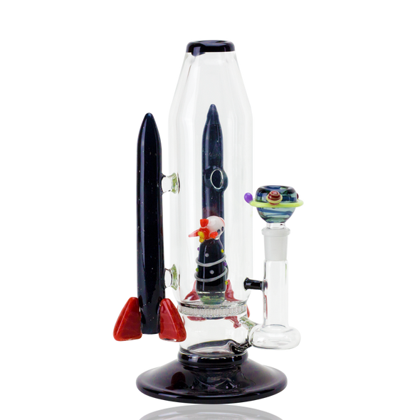 Side angle on white for retail smoke gear—9" Empire Glassworks rocket water pipe with interior rocket perc and included planet bowl on clear base.