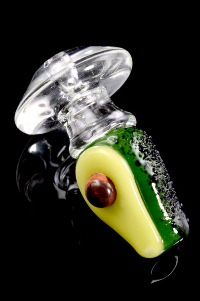 Matching avocado carb cap with clear press-fit base, close-up on black—detailed wholesale accessory for Puffco setups.