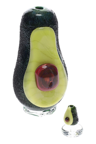 Avocado attachment beside mini carb cap, high-key white—complete set for retail smoke-shop buyers seeking novelty glass.
