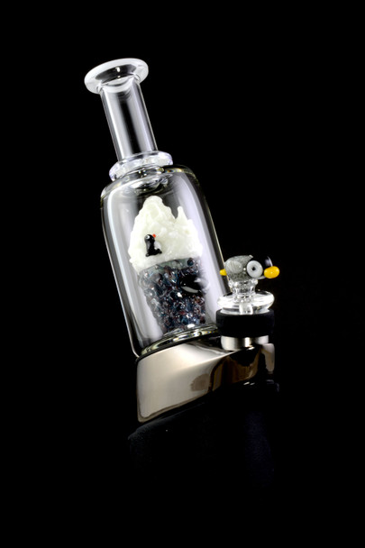 Side view installed on a Puffco Peak base, arctic iceberg centerpiece visible; premium art attachment for B2B head-shop buyers.