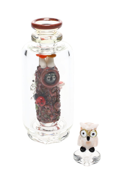 Alternate studio angle of Redwood attachment with owl carb cap installed; clear body and wood-textured core highlighted for retail smoke gear.