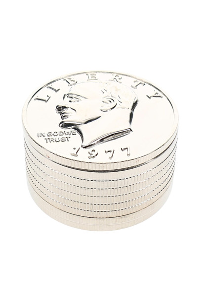 Compact coin metal grinder shown at an angle for smoke shop counter merchandising