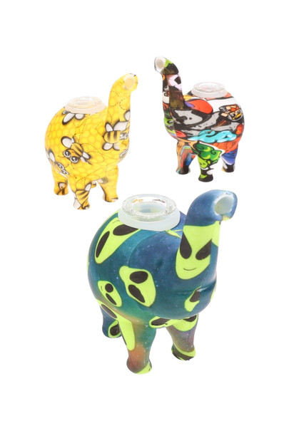 Assorted silicone elephant bubblers with removable glass bowls—pink floral, USA flag, and blue skull decals—6" tabletop size for head-shop wholesale. Assorted silicone elephant bubblers with removable glass bowls—pink floral, USA flag, and blue skull decals—6" tabletop size for head-shop wholesale.