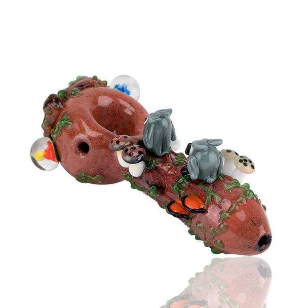 White-background product shot for wholesale catalogs: 4.5" forest spoon with sculpted owls, ladybug, and mushroom cluster along vine-detailed neck.