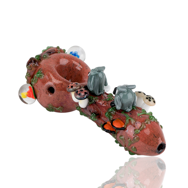 White-background product shot for wholesale catalogs: 4.5" forest spoon with sculpted owls, ladybug, and mushroom cluster along vine-detailed neck.