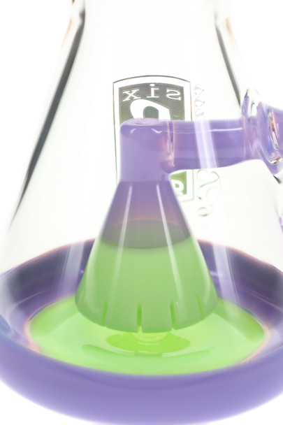 Close-up of the purple and green showerhead perc inside the clear beaker chamber with a purple base rim.