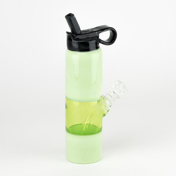 Side angle on white showing lime green bottle mini rig for retail smoke gear, 14.5 mm female connection with clear bowl inserted and handle loop cap.