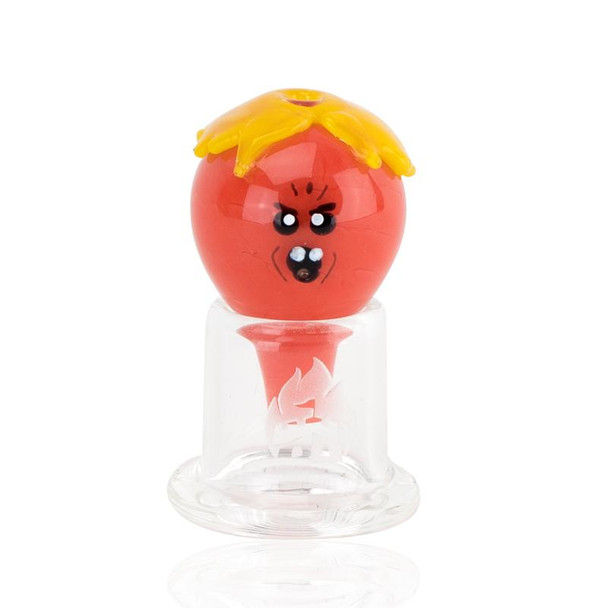 Red glass bubble cap with yellow drip crown and cartoon face, wholesale head-shop accessory, front view on white atop a clear quartz banger.