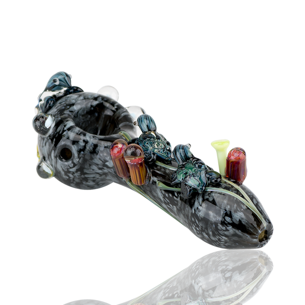 Side three-quarter product view for wholesale listings—4.5" glass spoon, dark current body with sculpted sea-life and multicolor reef marbles.