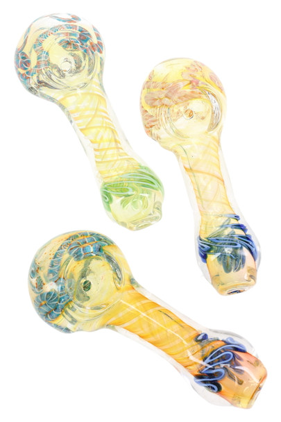 Wholesale 4" color-changing spiral striped glass spoon pipes with patterned bowls, assorted blue/green/orange variants, overhead trio view for retail cases. Wholesale 4" color-changing spiral striped glass spoon pipes with patterned bowls, assorted blue/green/orange variants, overhead trio view for retail cases.