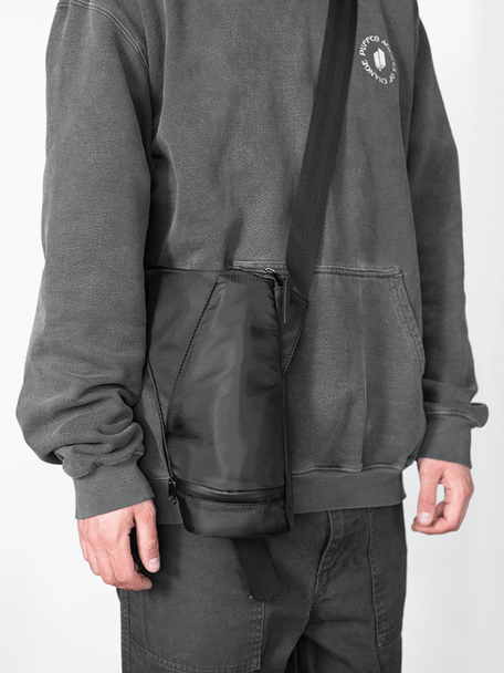 Journey Bag worn cross-body; adjustable strap and compact profile shown on model, lifestyle view for retail smoke-shop listings.