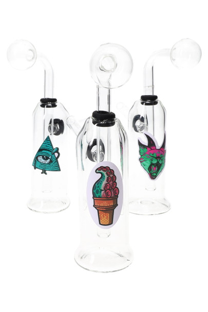 Three 5" thick clear glass oil burner rigs with assorted sticker decals, front three-quarter angle—wholesale head-shop case display.