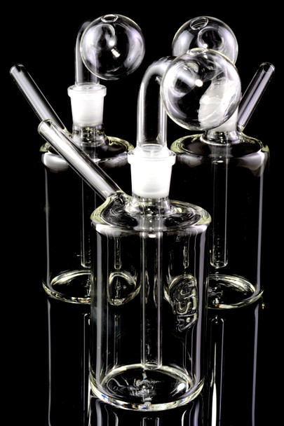 Three clear 5.5" glass oil burner rigs for wholesale retail smoke gear on black reflective display